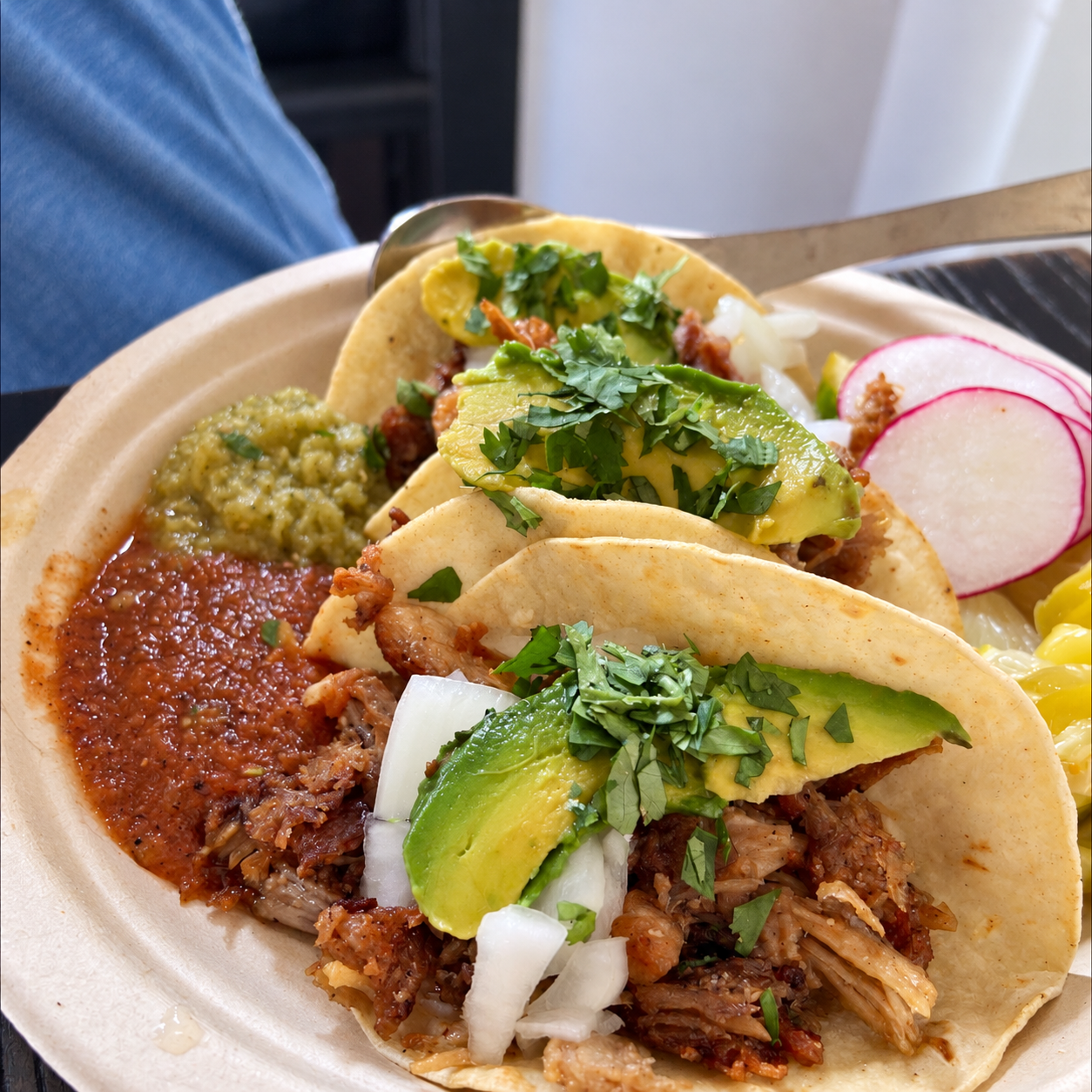 Three tacos with avocado, herbs and radish from the supplied Hilo food artwork.