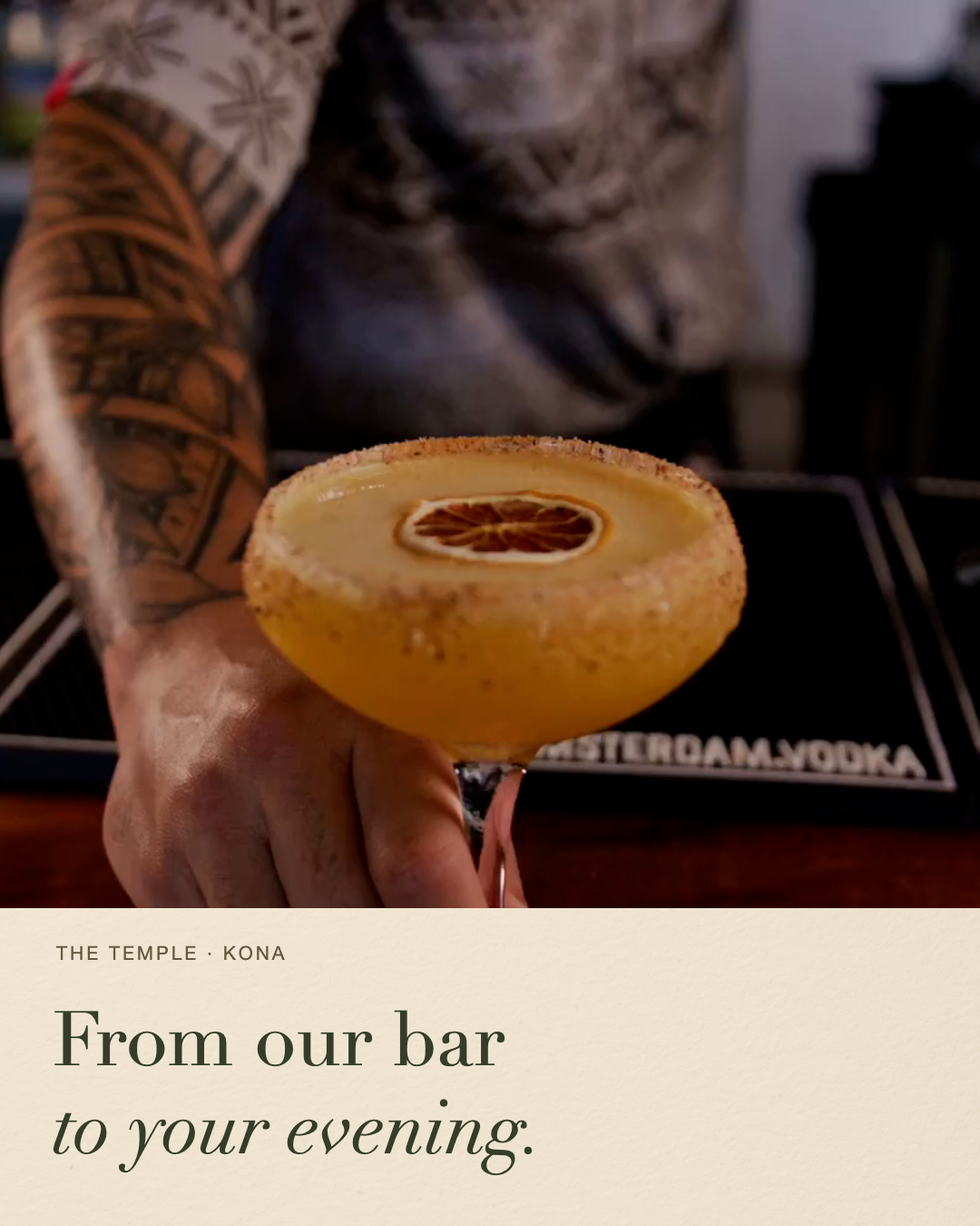 A Temple Kona bartender presenting a finished cocktail.